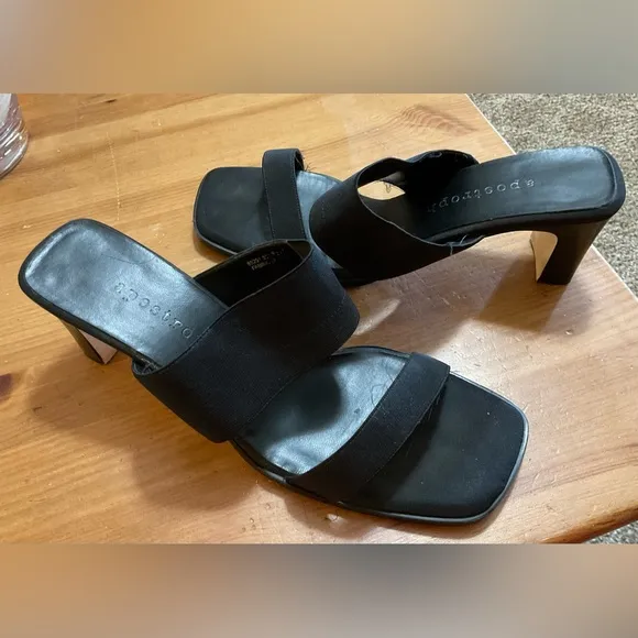 Black sandals with about a inch heel.
