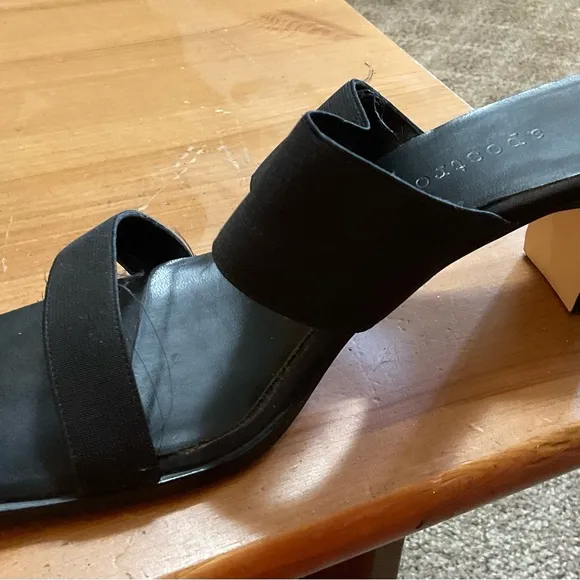 Black sandals with about a inch heel.