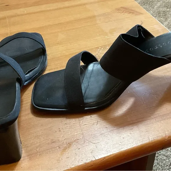 Black sandals with about a inch heel.