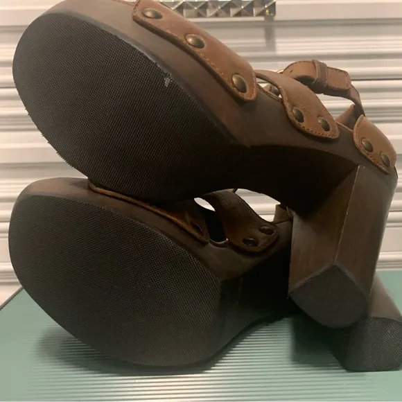 Brown leather Stuart Weitzman platform sandals.