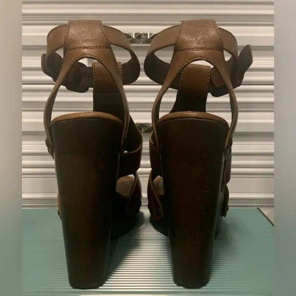 Brown leather Stuart Weitzman platform sandals.