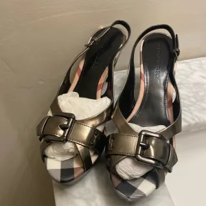 Burberry clog sandals never worn.I just don’t keep the original boxes.