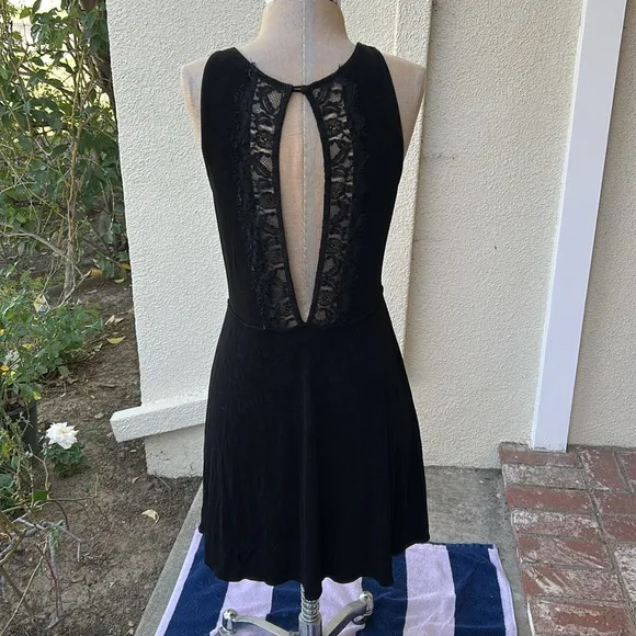 Free People Black Lady Jane Slinky stretch dress with open back lace trim.