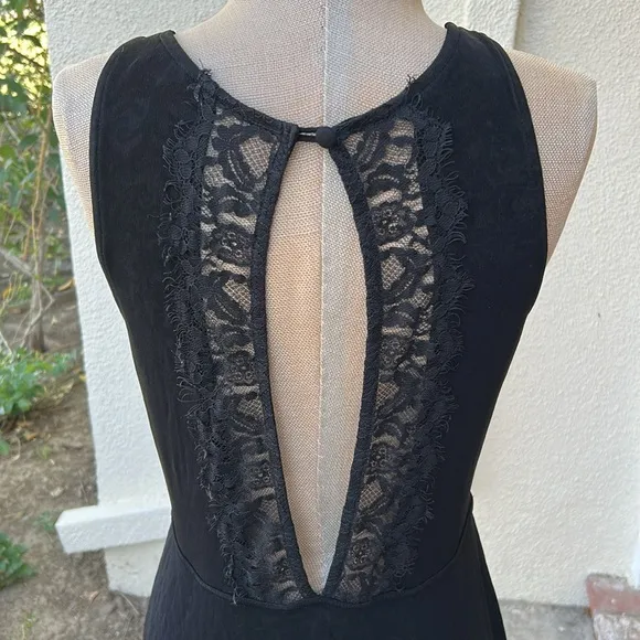 Free People Black Lady Jane Slinky stretch dress with open back lace trim.
