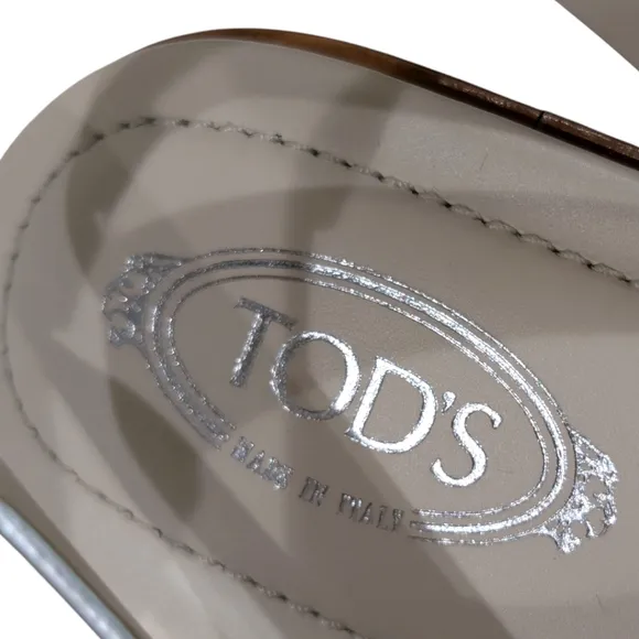 NWOT Tod's Metallic Silver Leather Ankle Strap FlatSandals Size 38.5